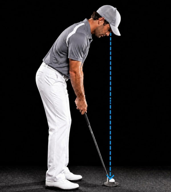 Golfer at address with his eyes directly over the ball
