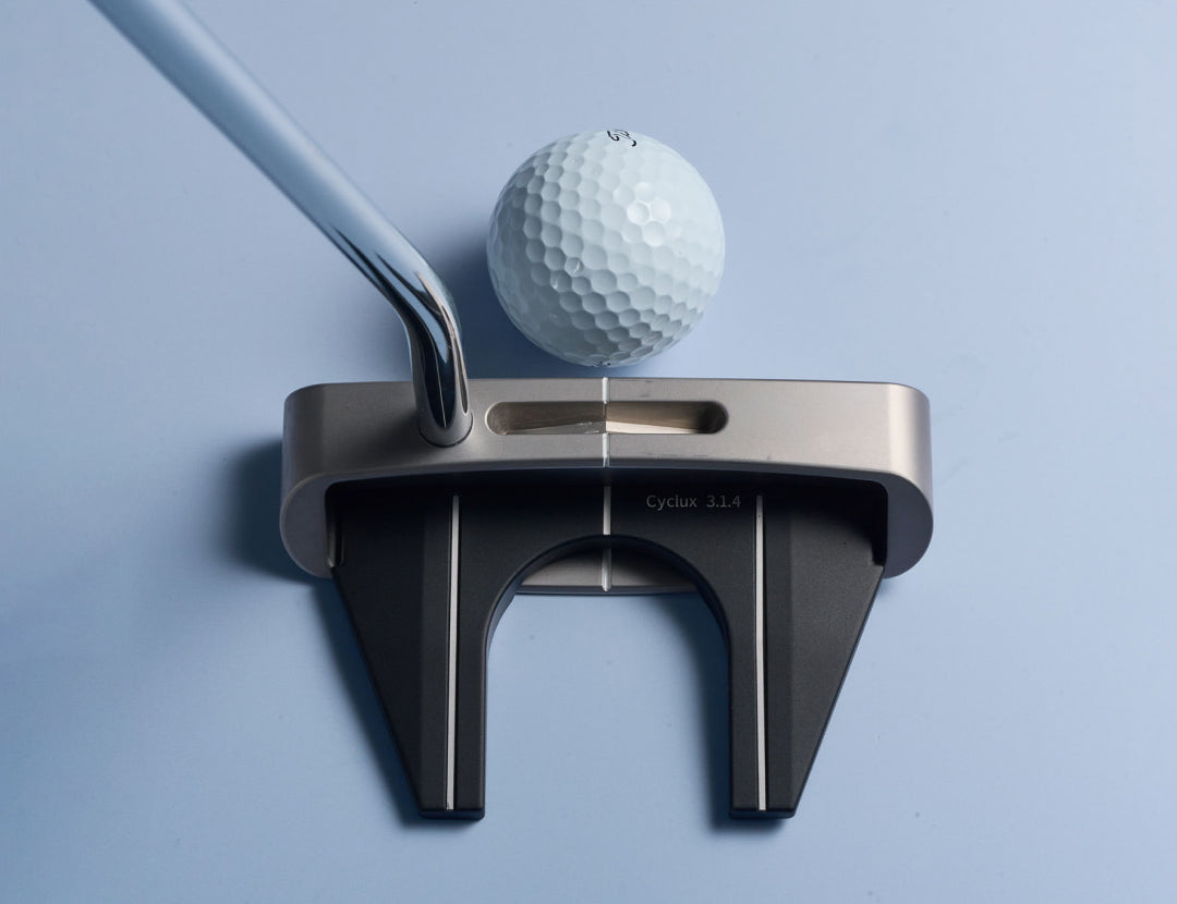 CYCLUX mallet behind a golf ball at address