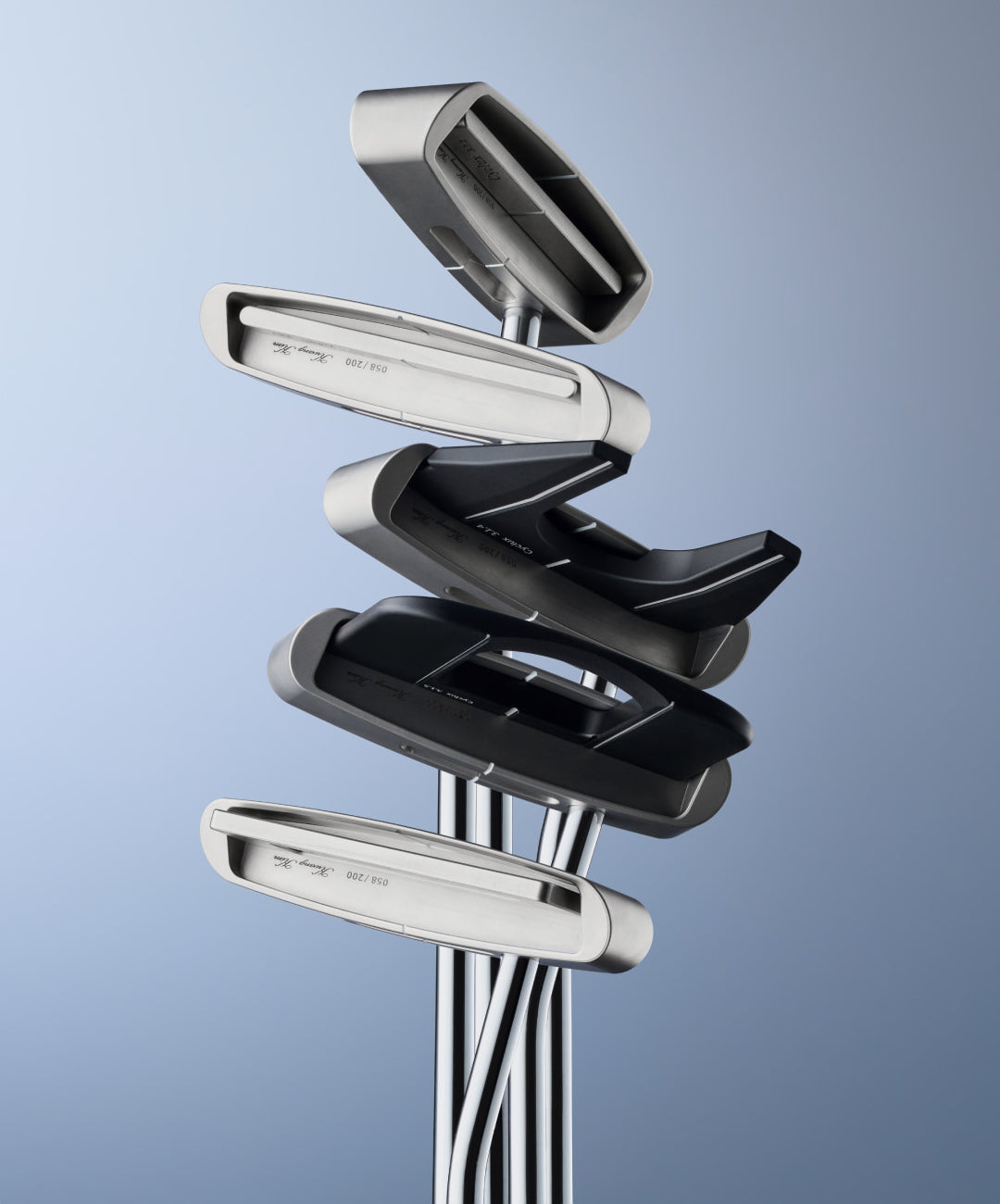 The five CYCLUX 3.1 putter heads stacked
